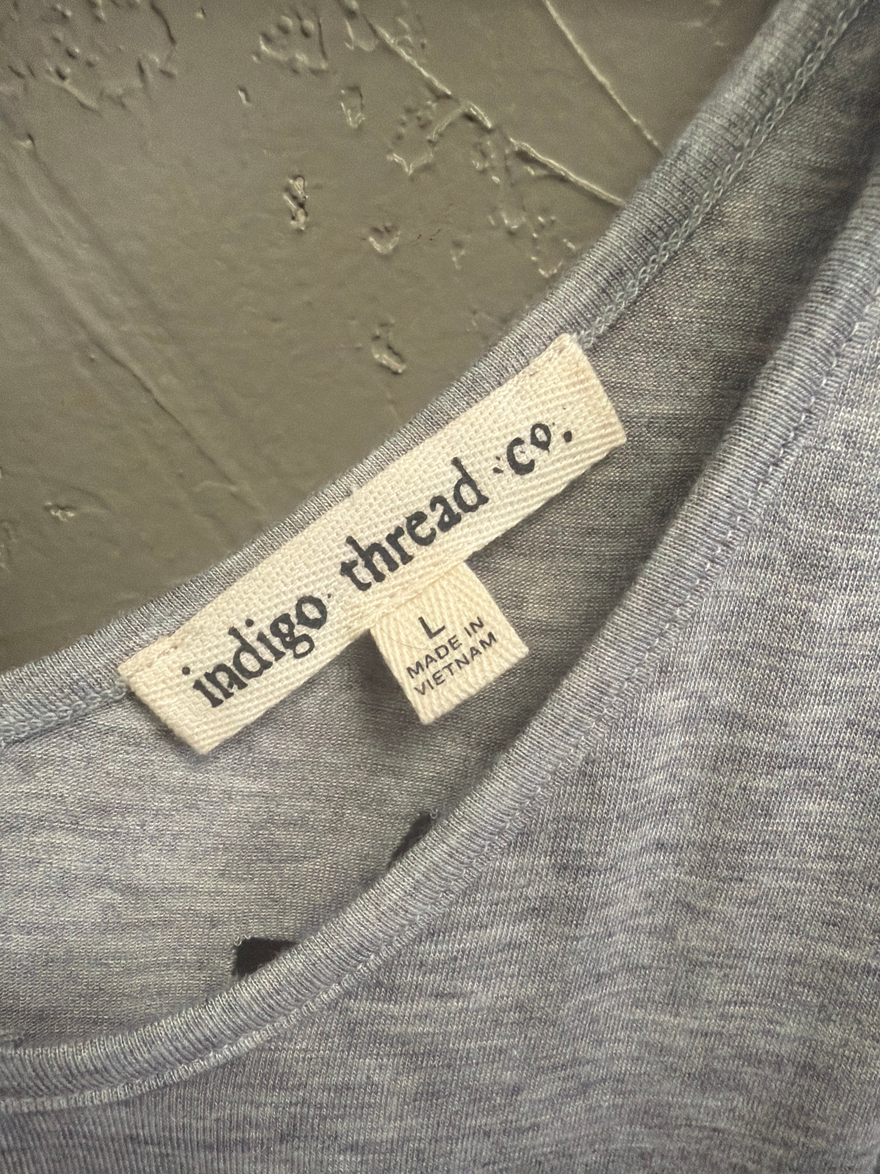 NWOT Indigo Thread Cutout Hi-Low Top